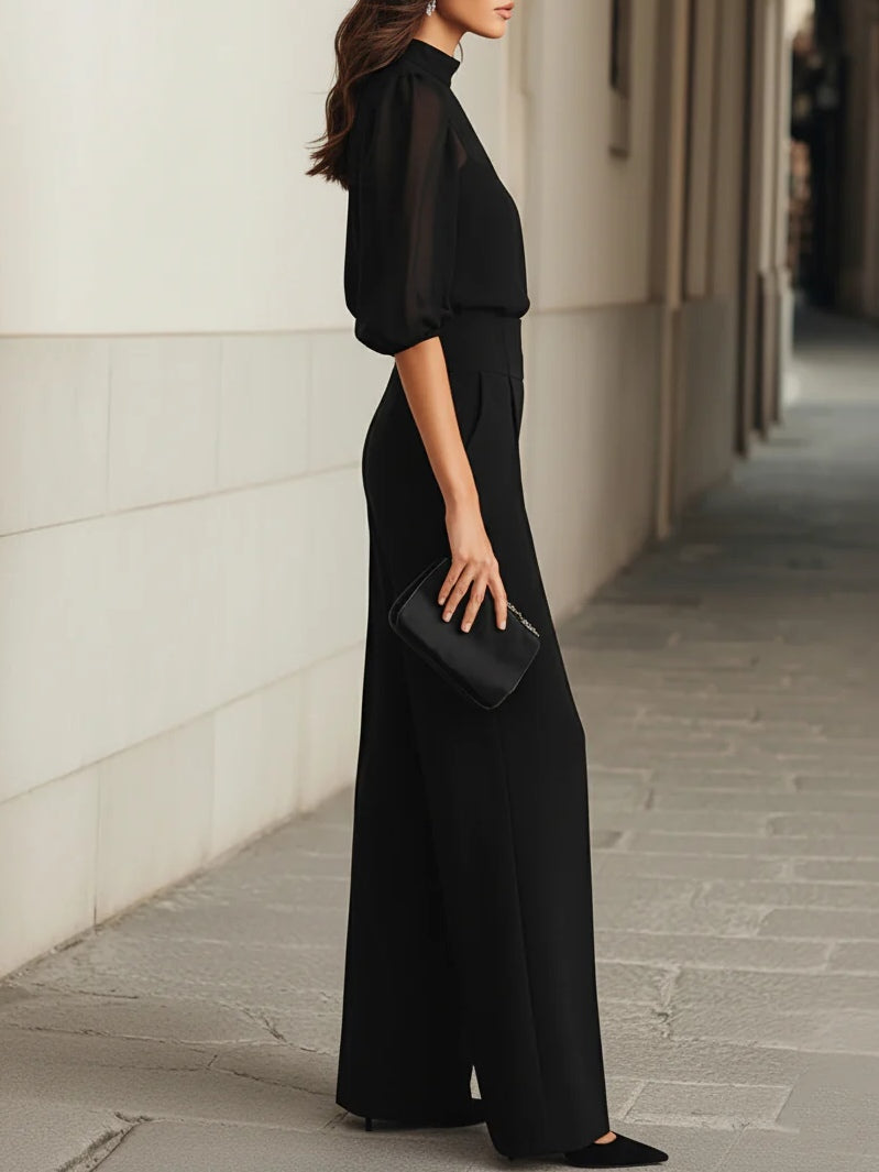 Valentina • Conjunto de tres piezas en negro compuesto por un top camisola transparente y unos pantalones de pierna ancha